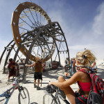 A Burning Man participant looks at an art project during the Burning Man 2011 "Rites of Passage" arts and music festival in the Black Rock desert of Nevada